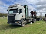 a truck that has a horse on the back of it