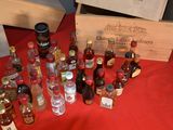 many bottles of alcohol sitting on a red table