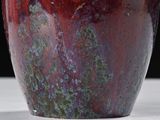 a close up of a vase on a table