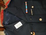 a uniform on a chair with a name tag on it
