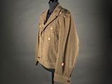 an image of a brown jacket on a mannequin stand
