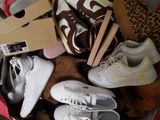 many pairs of shoes that are sitting in a box