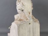 marble bust of a woman with a veil on her head