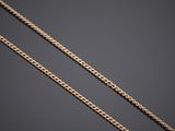 a gold chain on a black background