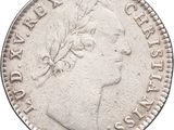 a close up of a coin on a white background