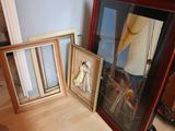 two framed pictures of a woman and a man on a sailboat