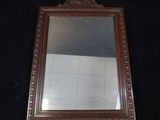 a mirror that is sitting on a black surface