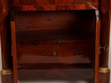 a small wooden cabinet with a mirror on top of it