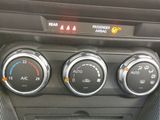 a control panel in the center of a car ' s dashboard