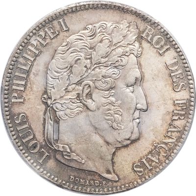 a close up of a coin with a man ' s face on it