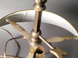 a small metal object with a propeller on top of it