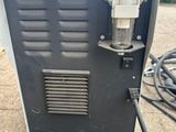 a close up of a machine that is sitting on the ground
