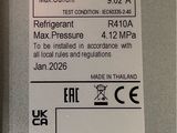 a label on the back of a refrigerator that says air conditioner