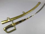 a pair of swords with gold and silver decorations on them