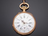 an antique pocket watch with roman numerals on a chain