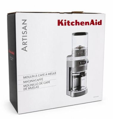 La boîte est ouverte pour montrer le contenu d'un moulin à café KitchenAid.