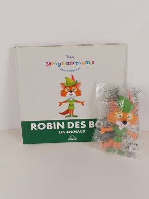 une boîte contenant une peluche, à côté d'un sachet de bonbons gélifiés