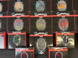 a lot of badges that are on a black table
