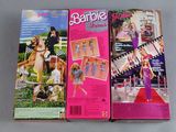 three barbie dolls are lined up on a table in front of each other