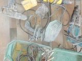 a display of electronic devices and wires on a shelf