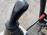 a close up of a steering control on a tractor