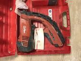 a red tool box with tools in it on the floor