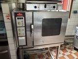 an image of a commercial kitchen with a stove and oven