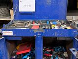 a blue work bench with tools in it