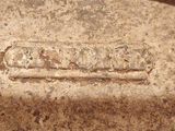 a close up of a metal object with writing on it