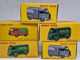 three boxes of dinky toys are stacked on top of each other