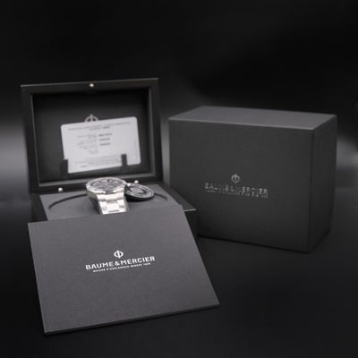 the watch is in a black box with a card in it