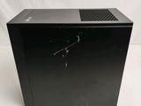 an image of a black desktop computer sitting on top of a table