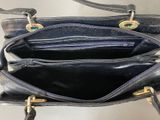 a black purse that is open on a table