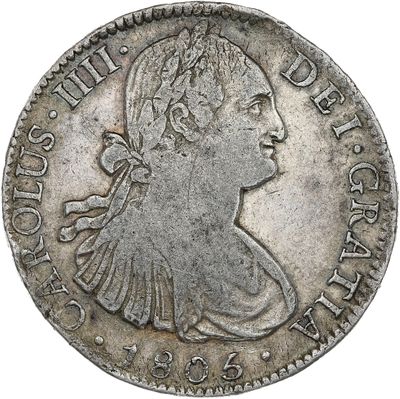 a silver coin with an image of a woman in profile