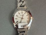 an image of a wrist watch with a chain around it