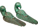 pair of green metal bird bookends on a white background