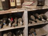 many bottles of wine on the shelves in the cellar