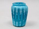 a blue vase that is sitting on a table