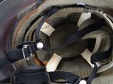 a close up of a helmet with a strap on it