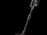 a close up of a cordless vacuum cleaner on a black background