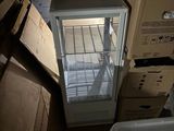a refrigerator that is sitting in the middle of a room