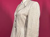 this image may contain a mannequin and a suit on a mannequin stand