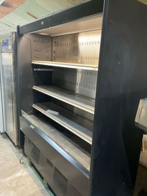 a refrigerator that has a bunch of empty shelves in it