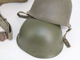 a helmet and a belt on a white surface