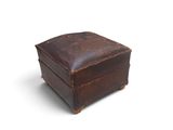 an old brown leather box with a lid on a white background