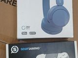 two sony headphones sitting on top of a cardboard box