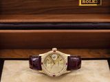 an image of a rolex watch in a case on a table