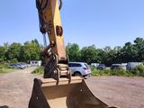the back end of a construction vehicle parked in a parking lot