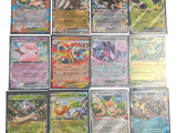 beaucoup de cartes pokemon sur la table