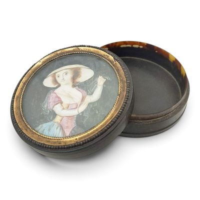 a small box with a picture of a woman on it